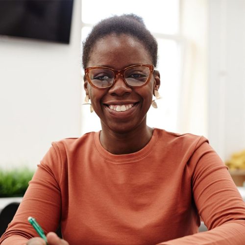front-view-portrait-young-black-woman-studying-college-smiling-happily-camera